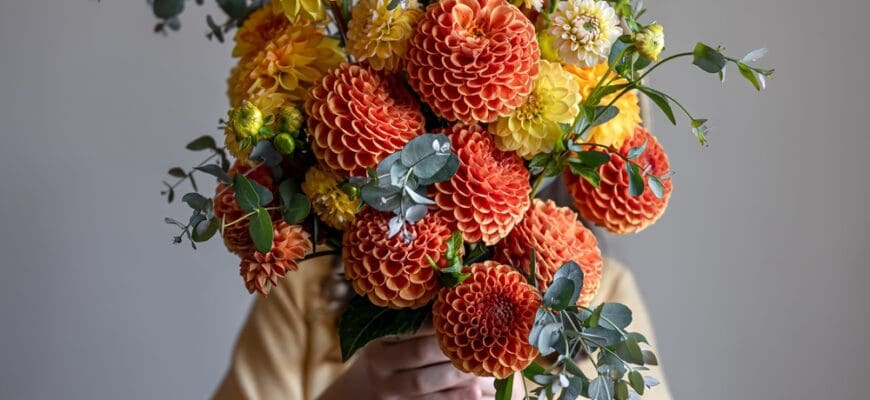 Woman,Hid,Her,Face,With,A,Bouquet,Of,Yellow,And